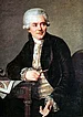 Jean Henri Riesener (1734-1806) war der wohl bedeutendste Möbelhersteller Frankreichs, der König Louis XVI. und seine Gattin Marie Antoniette belieferte. Mit dem Untergang des Ancien Regime verlor er auch seine wesentliche Einnahmequelle.